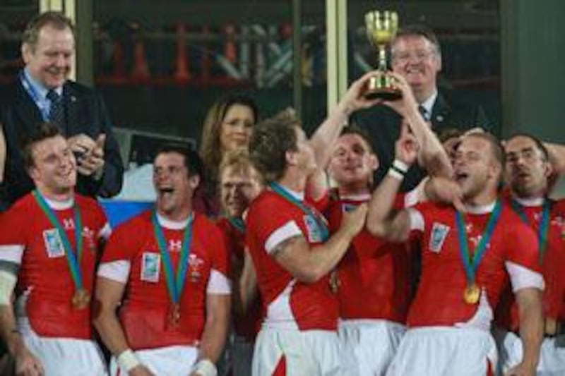 DUBAI, UNITED ARAB EMIRATES - MARCH 07:  Wales celebrate with their trophy after winning their men’s final cup match against Argentina on the final day of the Rugby World Cup Sevens 2009 held at The Sevens rugby grounds in Dubai on March 07, 2009.   (Randi Sokoloff / The National)  For sports/news.
