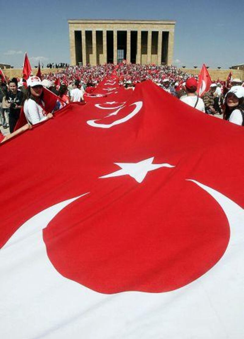 Supporters of Turkey's secular system display a giant national  flag outside the tomb of the national hero Mustafa Kemal Ataturk in Ankara.