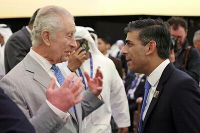 King Charles III speaks to UK Prime Minister Rishi Sunak at Cop28 in Dubai. PA