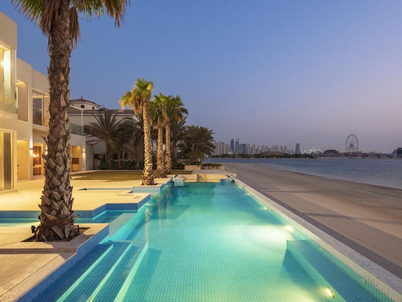 The Palm Jumeirah Villa infinity pool offers sprawling views of Ain Dubai and Dubai skyline