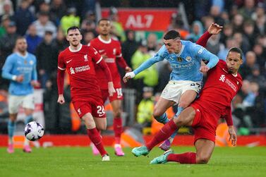 Liverpool's Virgil van Dijk challenges Manchester City's Phil Foden during the Premier League match at Anfield, Liverpool. Picture date: Sunday March 10, 2024. PA Photo. See PA story SOCCER Liverpool. Photo credit should read: Peter Byrne/PA Wire.

RESTRICTIONS: EDITORIAL USE ONLY No use with unauthorised audio, video, data, fixture lists, club/league logos or "live" services. Online in-match use limited to 120 images, no video emulation. No use in betting, games or single club/league/player publications.