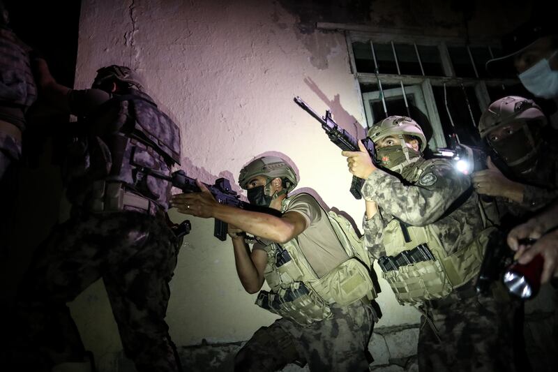 Turkish security forces raid houses used by smugglers in the eastern city of Van, about 100 kilometres from Iran. EPA