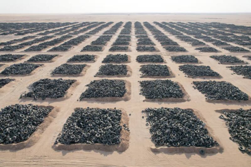 A tyre graveyard at Sulaibiya, five kilometres south of Al Jahra near Kuwait City, Kuwait. Discarded tyres stored as landfill threaten the environment and human health because they take a long time to degrade and contain dangerous components.