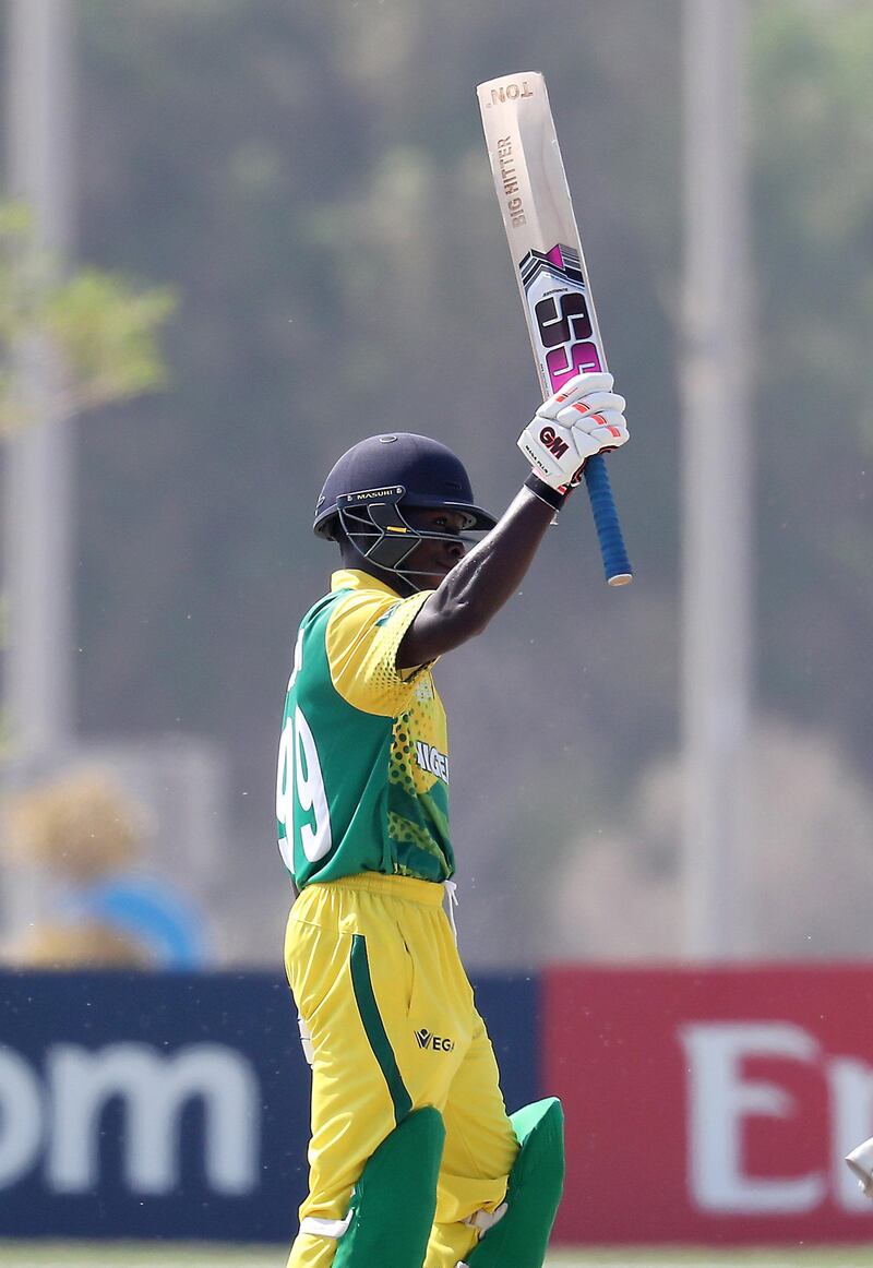 ABU DHABI , UNITED ARAB EMIRATES , October 24  – 2019 :- Sesan Adedeji of Nigeria celebrating after scoring his half century during the World Cup T20 Qualifiers between UAE vs Nigeria held at Tolerance Oval cricket ground in Abu Dhabi. UAE won the match by 5 wickets.  ( Pawan Singh / The National )  For Sports. Story by Paul