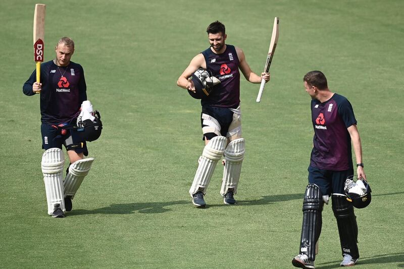 England's Mark Wood, centre, dances to music at the stadium after a practice session ahead of the first T20 at the Narendra Modi Stadium in Ahmedabad. AFP