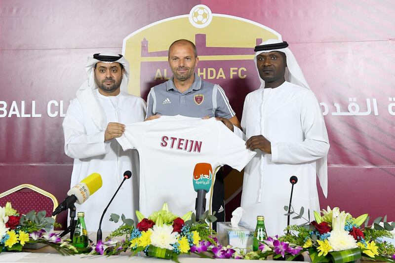 From left: Ahmed Al Rumaithi, chairman of Al Wahda’s board of directors, Maurice Steijn, the club's new first-team manager, and Abdulsalaam Juma, team manager, during Steijn's presentation ceremony in Abu Dhabi on Monday. Courtesy Al Wahda