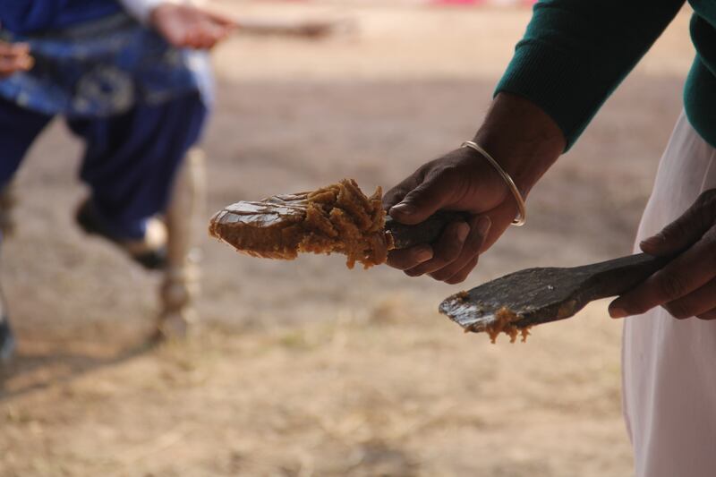 The cooled mixture, called jaggery, or gur, is broken into blocks.