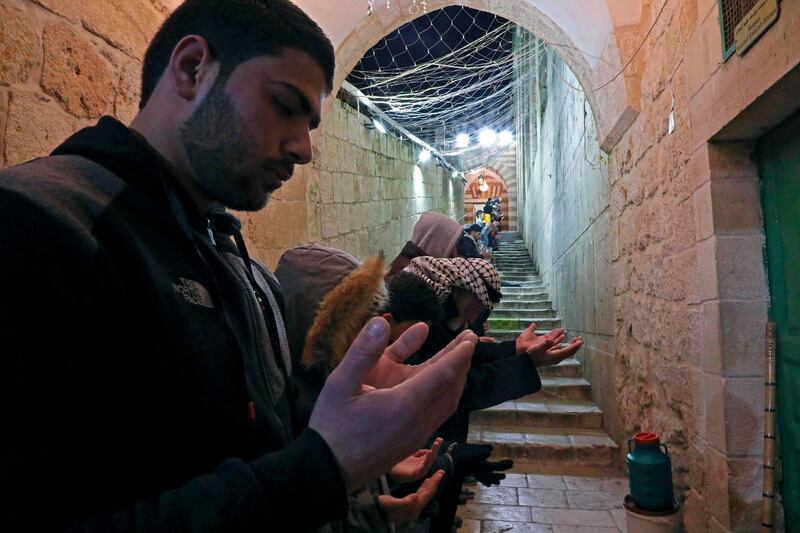 Palestinians perform Friday morning prayers at a religious site known to Muslims as the Ibrahimi Mosque in the divided West Bank town of Hebron. AFP