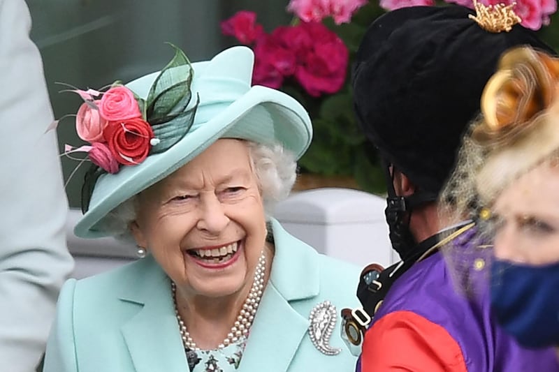 Queen Elizabeth II meets jockey Frankie Dettori on the fifth day of the Royal Ascot horse-racing meet. AFP