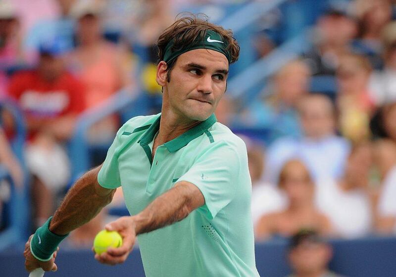 Roger Federer prepares a serve against David Ferrer during his Cincinnati Masters final victory on Sunday. Jonathan Moore / Getty Images / AFP / August 17, 2014