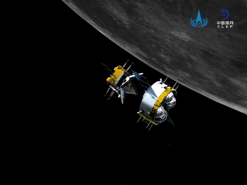 This graphic simulation image provided by China National Space Administration shows the orbiter and returner combination of China's Chang'e-5 probe after its separation from the ascender, at the Beijing Aerospace Control Center (BACC) in Beijing Sunday, Dec. 6, 2020. The Chinese probe that landed on the moon transferred rocks to an orbiter Sunday in preparation for returning samples of the lunar surface to Earth for the first time in almost 45 years, the country's space agency announced. (China National Space Administration/Xinhua via AP)