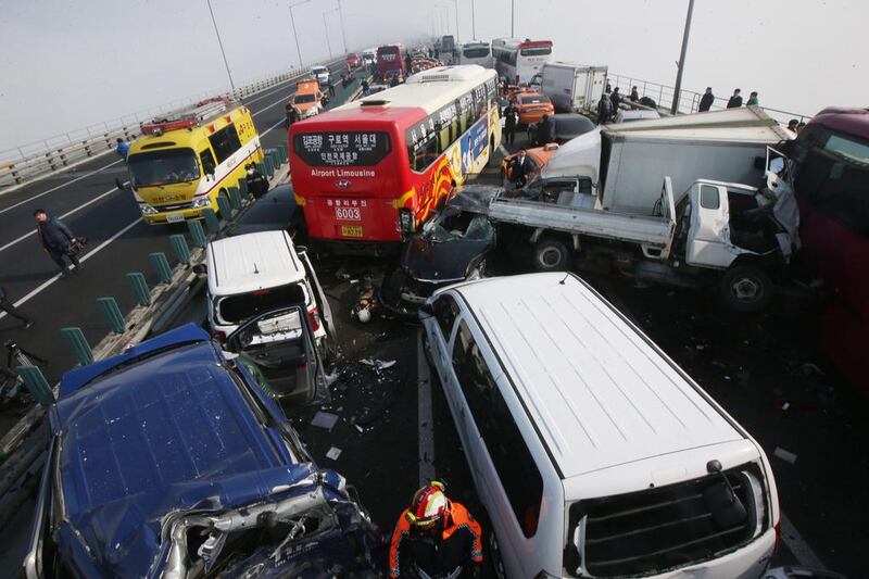 Damaged vehicles sit on Yeongjong Bridge in Incheon. Suh Myung-gon / Yonhap / AP Photo