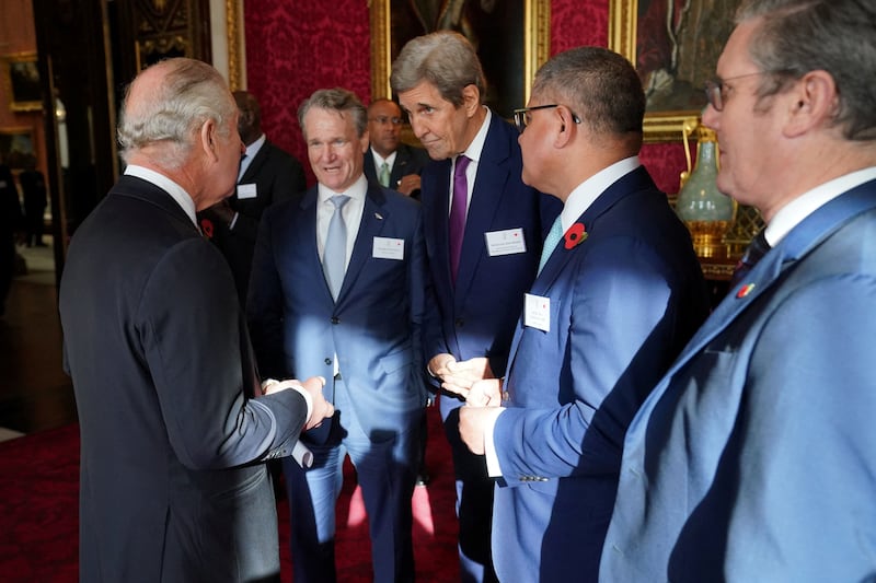 King Charles speaks with Brian Moynihan, chairman and chief executive of Bank of America and co-chairman of the Sustainable Markets Initiative, Mr Kerry, Alok Sharma and Labour leader Keir Starmer. Reuters