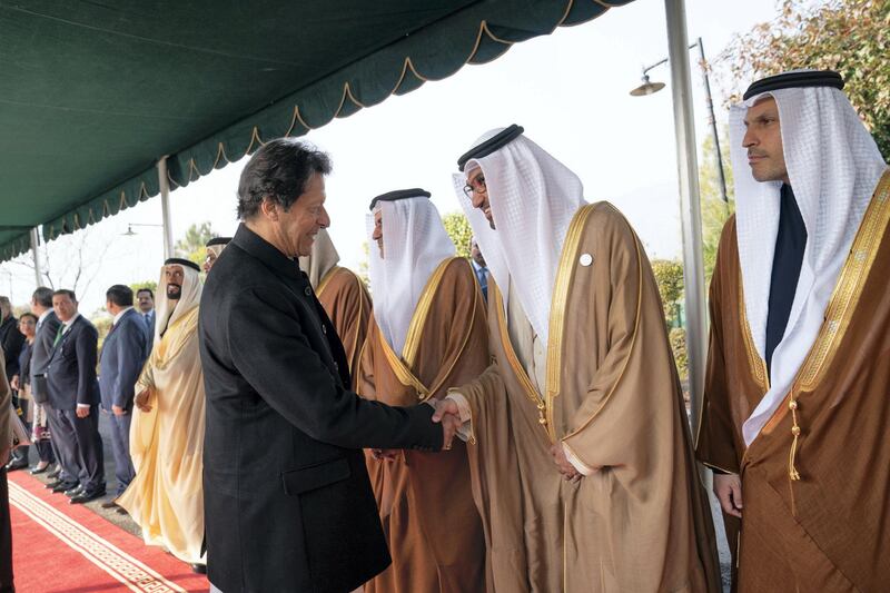 ISLAMABAD, PAKISTAN - January 06, 2019: HE Dr Sultan Ahmed Al Jaber, UAE Minister of State, Chairman of Masdar and CEO of ADNOC Group (2nd R), greets HE Imran Khan, Prime Minister of Pakistan (L), at the Prime Minister's residence. 

(  Mohammed Al Hammadi / Ministry of Presidential Affairs )
---