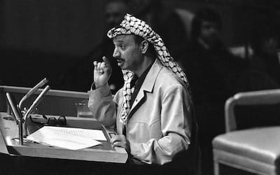 Yasser Arafat, chairman of the Palestine Liberation Organization (PLO), makes a point during his speech before the United Nations General Assembly in New York, Wednesday, Nov. 14, 1974.  At the end of his speech, Arafat shook his finger at the delegates and declared, "I have come bearing an olive branch and a freedom fighter's gun. Do not let the olive branch fall from my hand."  (AP Photo)