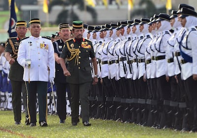 Brunei's Sultan Hassanal Bolkiah inspects an honour guard during the 34th National Day celebrations in Bandar Seri Begawan, Brunei. He is the world's second-longest reigning living ruler. Reuters