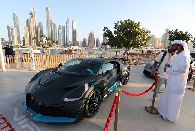 Visitors check out a sleek Bugatti at the NoFilter DXB event. EPA