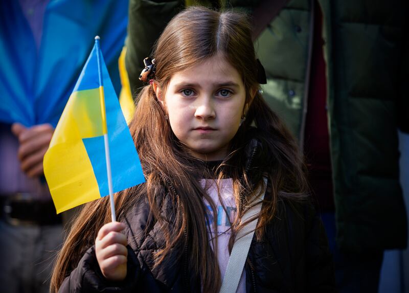 A young girl takes part in a rally in defence of 'Ukraine, Europe and democratic values', organised by the Association of Ukrainians in Portugal, outside the Russian Consulate in Porto, Portugal. EPA