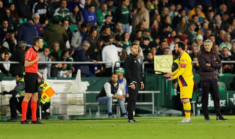 Lionel Messi appeals to the linesman during the match against Real Betis. Reuters