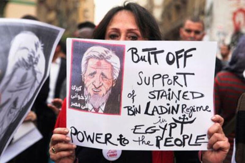 Egyptian protesters march towards the foreign ministry in Cairo on Saturday. Asmaa Waguth / Reuters