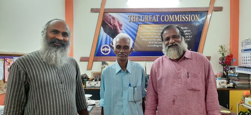 Sajid Thungal, centre, was reunited with his family with the help of Pastor K M Philip, right. They are seen with Pastor Biju Samuel.