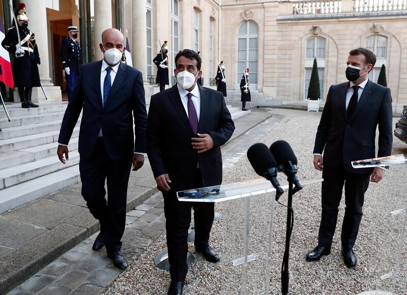 French President Emmanuel Macron flanked by Head of Libya's Presidential Council, Mohamed al-Menfi and Vice President of Libya's Presidential Council, Musa Al-Koni prepare to hold a joint statement after a meeting at Elysee Palace in Paris. EPA