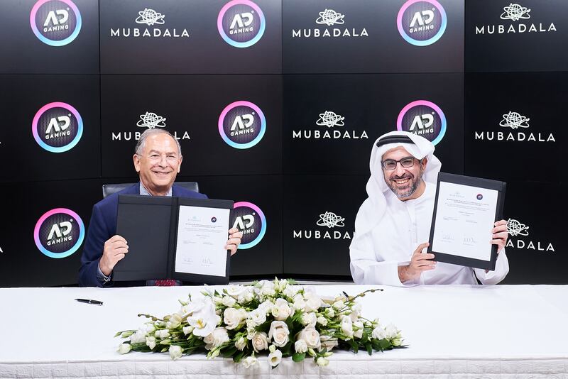 Badr Al Olama, right, and James Hartt at the signing ceremony between Mubadala and Abu Dhabi Gaming. Photo: Mubadala