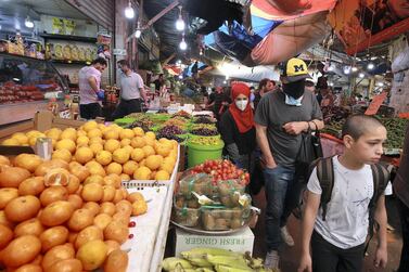 File photo: Shoppers attend a market on April 23, 2020, in the Jordanian capital Amman. AFP