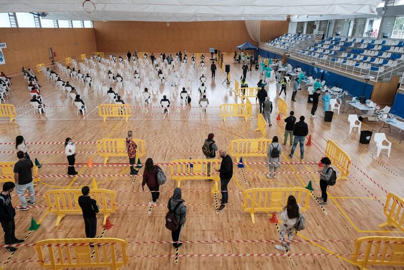 Dozens of people queue to participate in mass testing in Sant Josep, a town in Can Guerxo, Ibiza island, Balearics. EPA