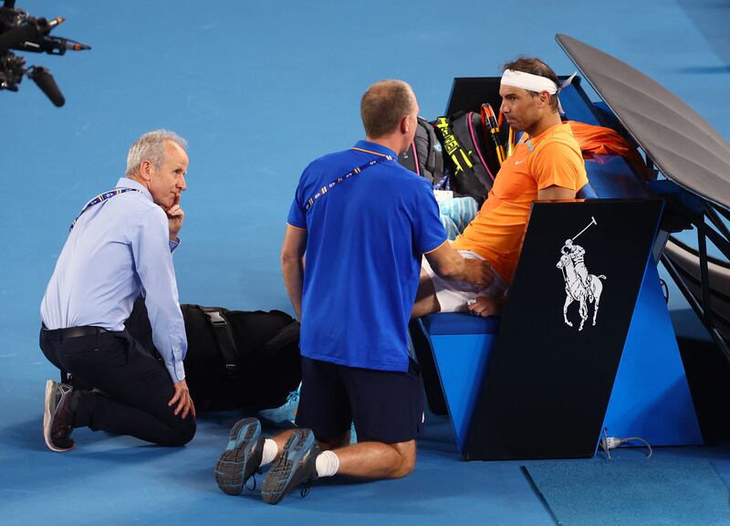  Rafael Nadal receives medical attention after sustaining an injury during his second round match against Mackenzie Mcdonald. Reuters