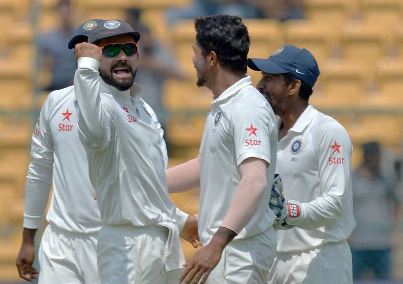 Indian players celebrate the dismissal of Australia's Steve Smith during the fourth day of the second Test in Bengaluru on March 9, 2017. AFP