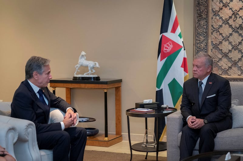 Jordan's King Abdullah and US Secretary of State Antony Blinken in Amman, on October 13, 2023.  Jordanian Royal Palace