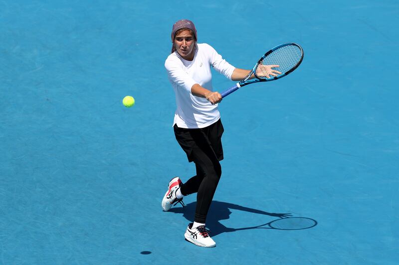 Meshkatolzahra Safi of Iran hit a backhand in her round one junior singles match against Anja Nayar of Australia. getty