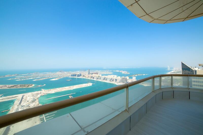 The apartment's balcony looks out over Palm Jumeirah and the developing Dubai Harbour. Courtesy Allsopp and Allsopp