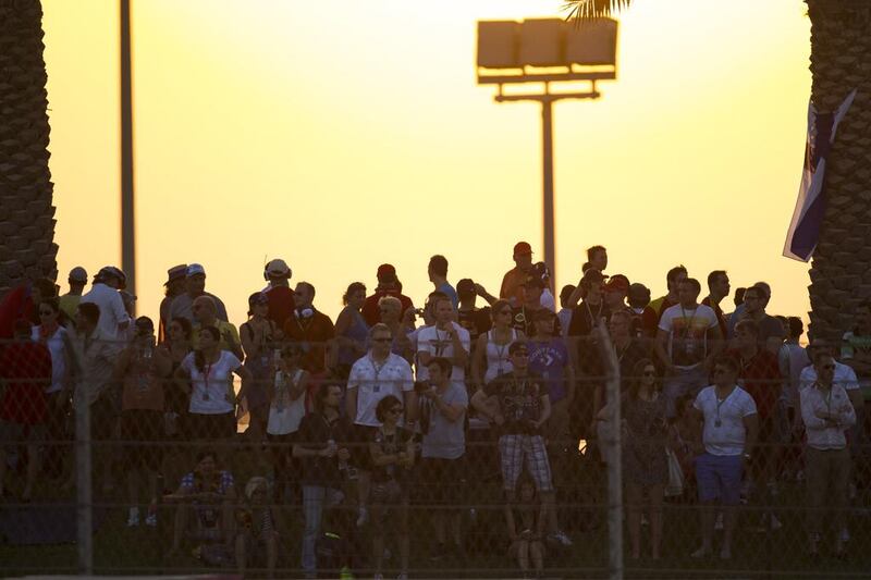 Spectators watch from Abu Dhabi hill during the Formula One Etihad Airways Abu Dhabi Grand Prix Yas Marina Circuit in Abu Dhabi. Christopher Pike / The National