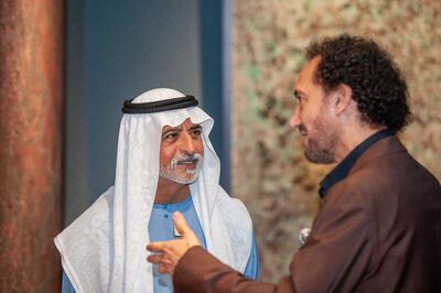 Sheikh Nahyan bin Mubarak, Minister of Tolerance and Coexistence, speaks to Naseer Shamma at the opening of his art exhibition, Half Life. Photo: Etihad Modern Art Gallery