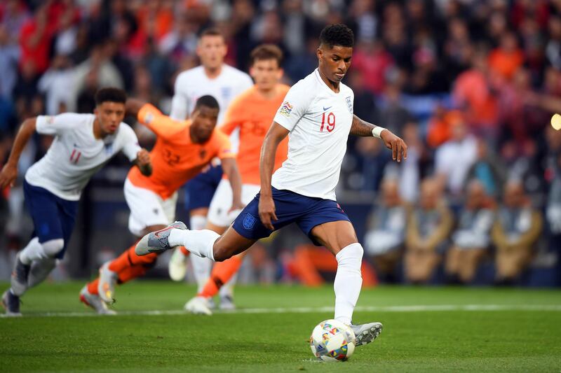 epa07631305 England's Marcus Rashford, right, scores the 1-0 lead from the penalty spot. EPA