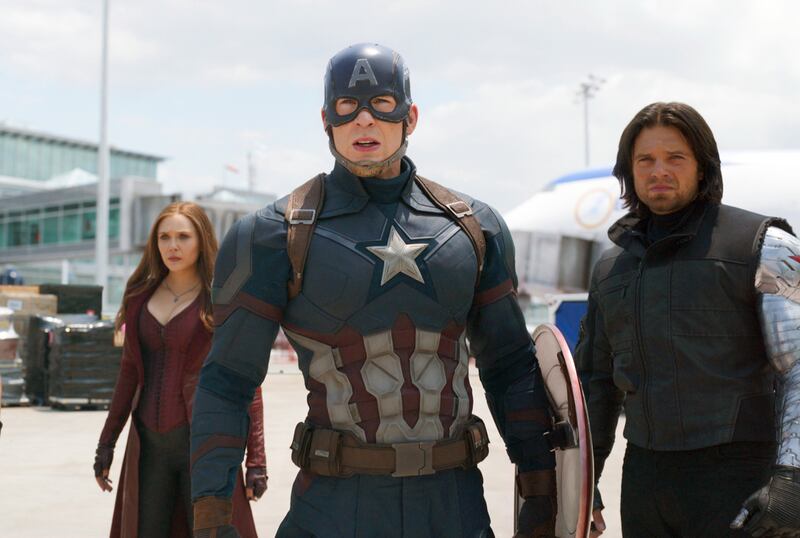 This image released by Disney shows Elizabeth Olsen, left, Chris Evans and Sebastian Stan in a scene from Marvel's "Captain America: Civil War." Evans has wrapped his final performance as Captain America. Evans tweeted  Thursday, Oct. 4, 2018, that his last shooting day on â€œAvengers 4â€ was an â€œemotional day.â€  The 37-year-old actor thanked his colleagues and fans for his eight years as Captain American, saying it â€œhas been an honor.â€ â€œAvengers 4â€ is slated to open in May next year. (Disney/Marvel via AP)
