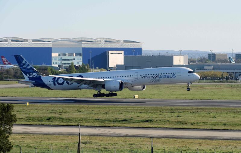 An Airbus A350-1000 airplane transporting face masks from China to Europe, lands at the Toulouse-Blagnac Airport in Blagnac, southern France, where the Airbus headquarters are located, on April 5, 2020, during a strict lockdown in France aimed at curbing the spread of the COVID-19 (novel coronavirus) pandemic.  European aircraft manufacturer Airbus shipped 4 million face masks from China to Europe, most of which are destined for the health authorities of the countries where the company operates, a spokeswoman for the group said on April 5. The aircraft had landed in Hamburg on April 4, the other major site of the aeronautics group in Germany, to deposit the first batch of masks. / AFP / REMY GABALDA
