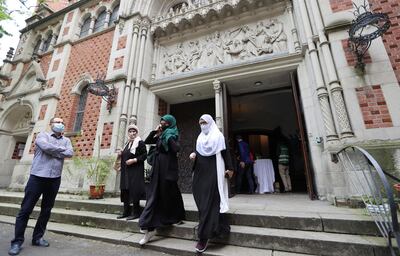 Muslims leave the evangelical church of St. Martha's parish, after their Friday prayers, as the community mosque can't fit everybody in due to social distancing rules, amid the coronavirus disease (COVID-19) outbreak in Berlin, Germany, May 22, 2020.   REUTERS/Fabrizio Bensch