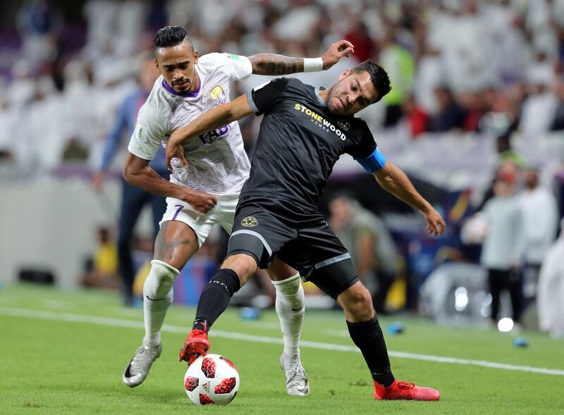 Al Ain, United Arab Emirates - December 12, 2018: Caio of Al Ain and Justin Gulley of Wellington compete during the game between Al Ain and Team Wellington in the Fifa Club World Cup. Wednesday the 12th of December 2018 at the Hazza Bin Zayed Stadium, Al Ain. Chris Whiteoak / The National