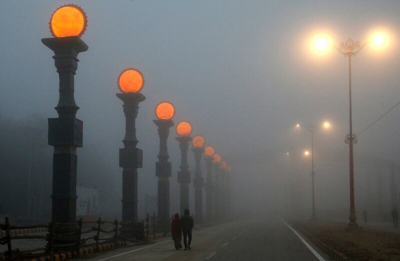 Illuminated installations shine through the fog in Ayodhya, Uttar Pradesh, India. EPA