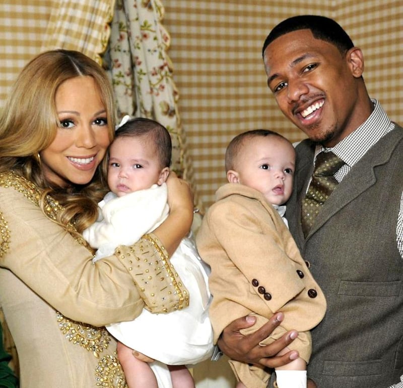 In this 2011 image released by ABC, correspondent Barbara Walter, left, poses with singer Mariah Carey and her husband Nick Cannon as they hold their six-month-old twins, Moroccan and Monroe. Donna Svennevik/ AP Photo / ABC 
