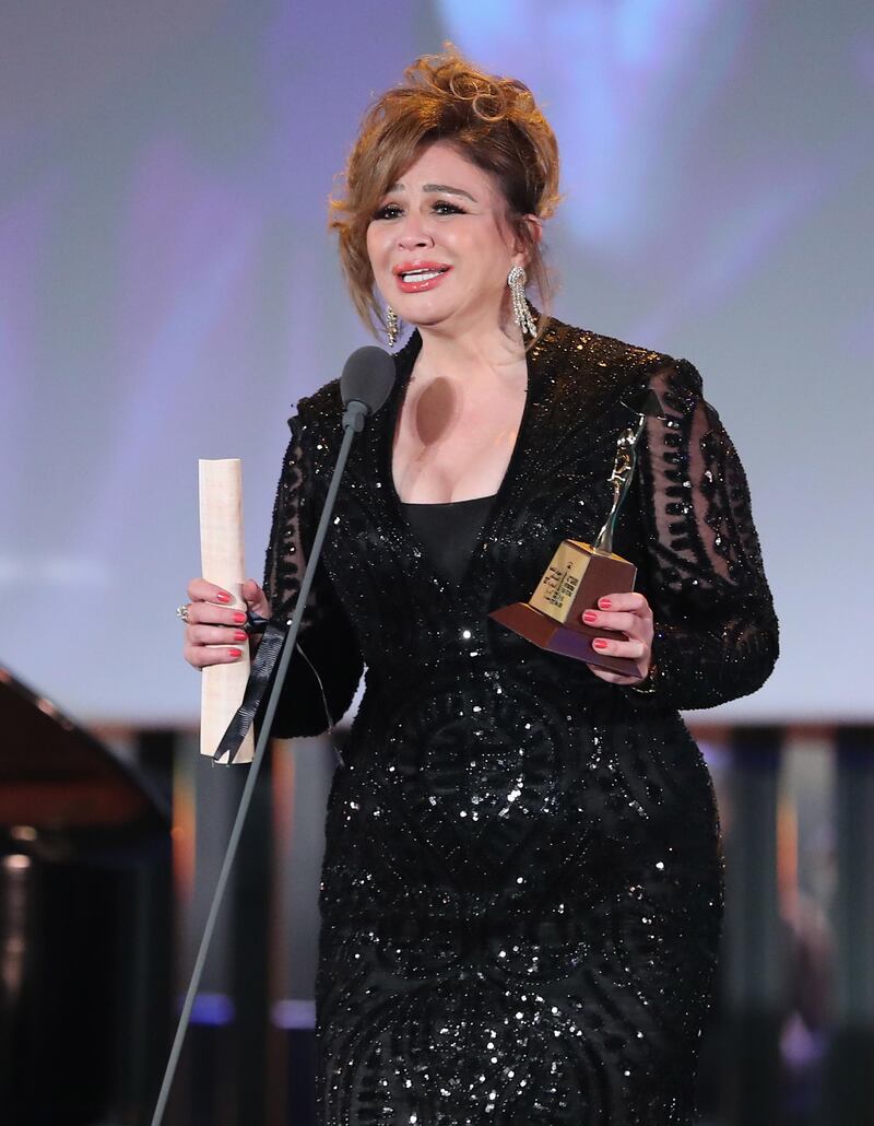 Egyptian actress Elham Shahin holds the Award for best actress during the closing ceremony of the 42nd  Cairo International Film Festival (CIFF). EPA