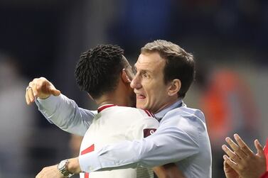 Harib Abdalla Suhail (L) of UAE celebrates with his coach Rodolfo Arruabarrena after scoring the 1-0 goal during the FIFA World Cup 2022 Qualifiers soccer match between the UAE and South Korea in Dubai, United Arab Emirates, 29 March 2022.   EPA / ALI HAIDER