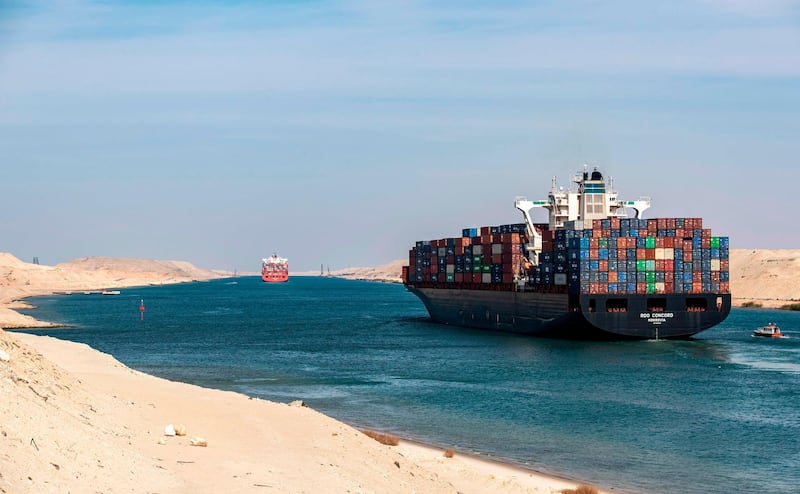 The Liberia-flagged container ship RDO Concord sailing through Egypt's Suez Canal near Ismailia on the 150th anniversary of the canal's inauguration.  AFP