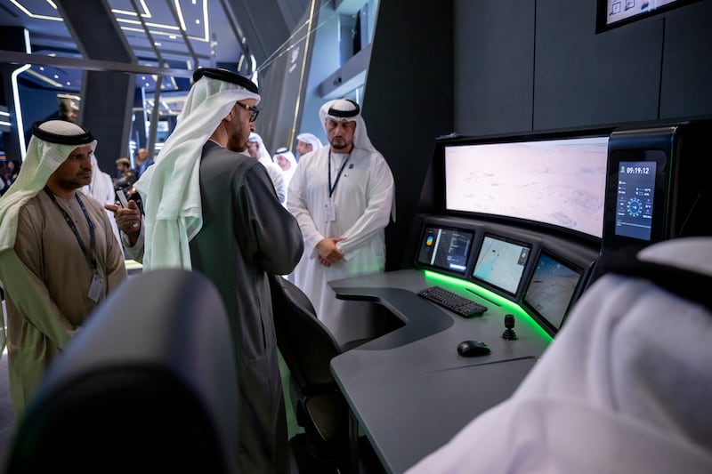 President Sheikh Mohamed visits a booth at Idex