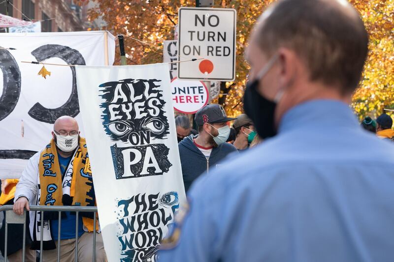 Protesters urge vote counting outside the Pennsylvania Convention Center. AFP