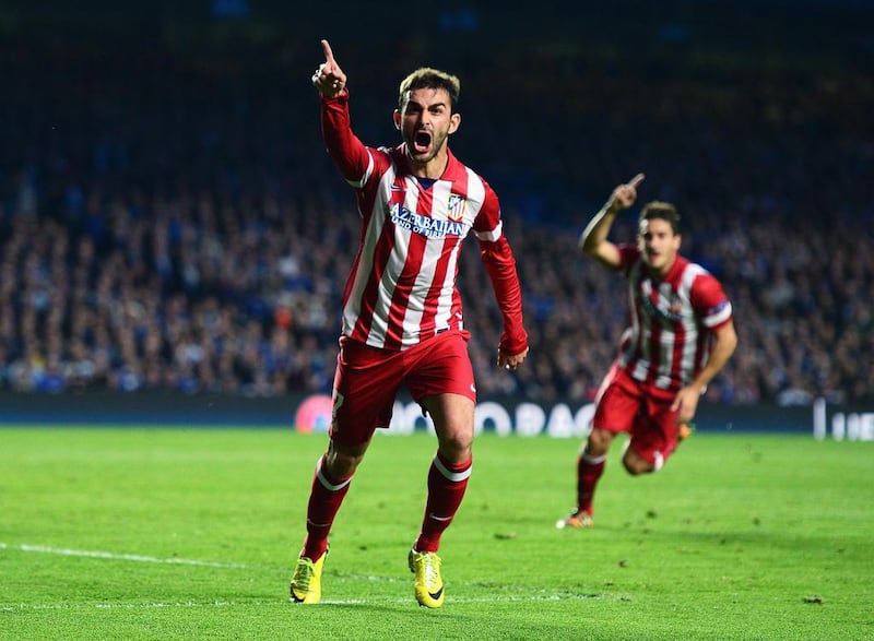 Adrian Lopez of Atletico Madrid celebrates scoring his goal during the Uefa Champions League semi-final second leg match against Chelsea at Stamford Bridge on April 30, 2014 in London, England. Jamie McDonald/Getty Images