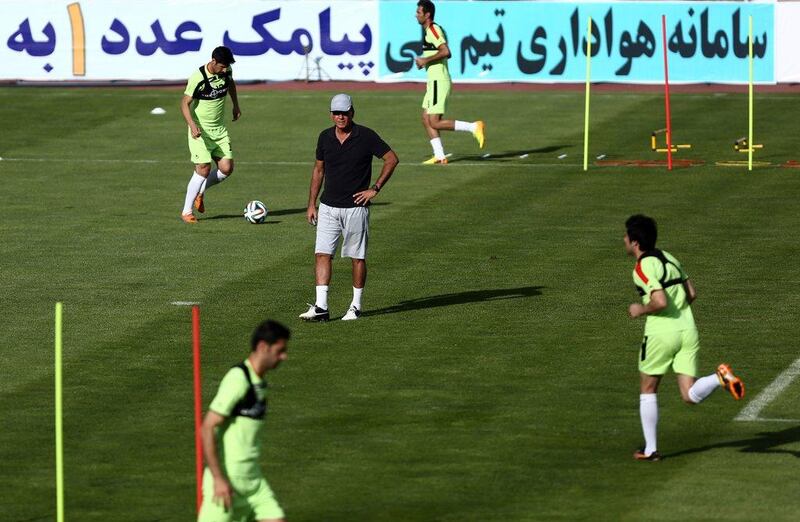 Carlos Queiroz, centre, conducts a training session with the Iran national football team on Sunday. Behrouz Mehri / AFP / May 11, 2014